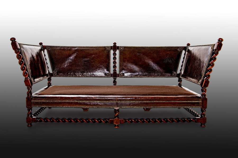 An Arts and Crafts walnut settee