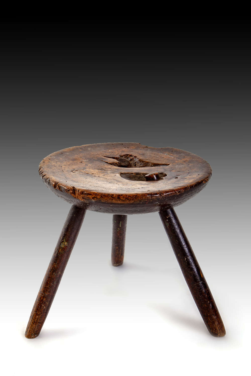 A 19th century ash dairy stool
