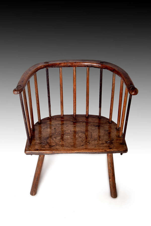 A rare 18th century stick back armchair
