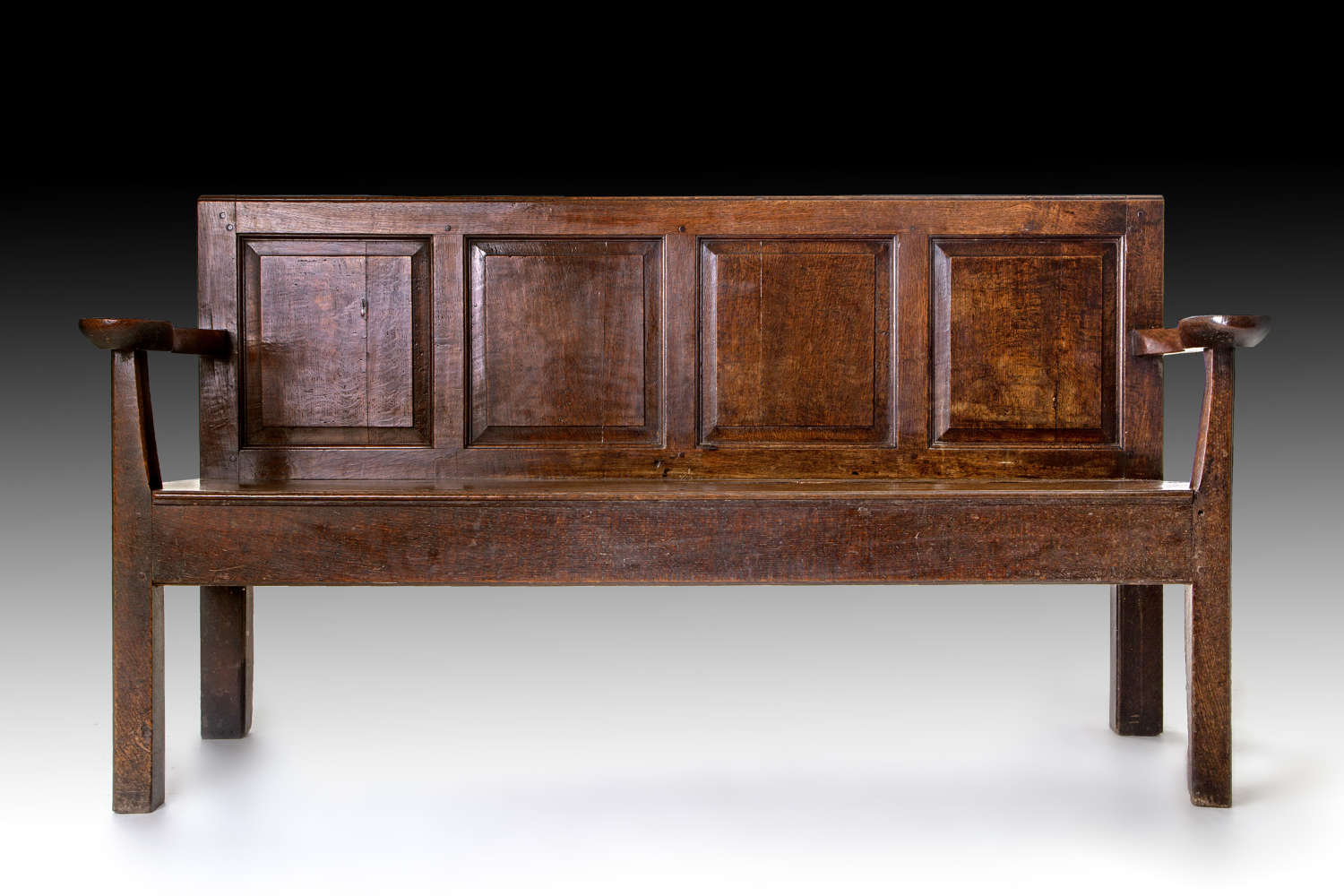 An late 18th century oak hall bench