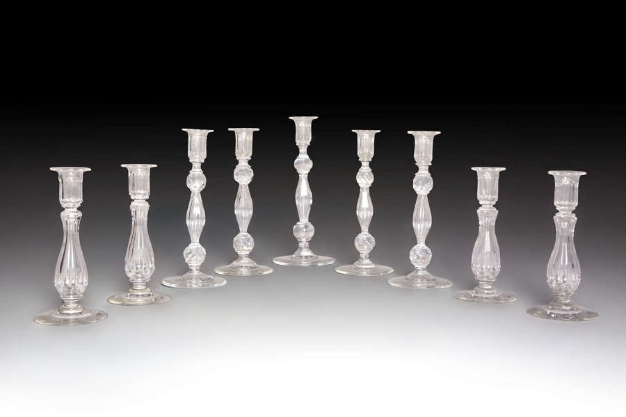 A collection of glass candlesticks