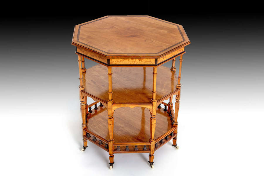 A late 19th century octagonal satinwood etagere