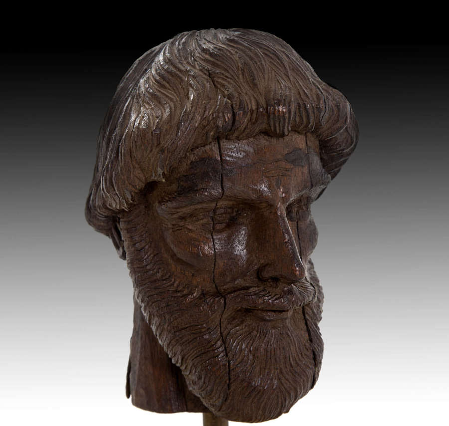 A finely carved 17th century head of a scholar