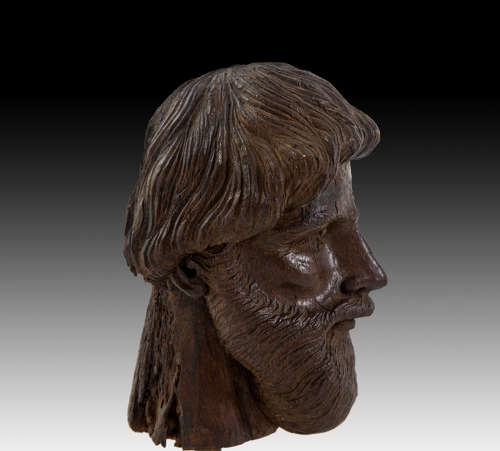 A finely carved 17th century head of a scholar