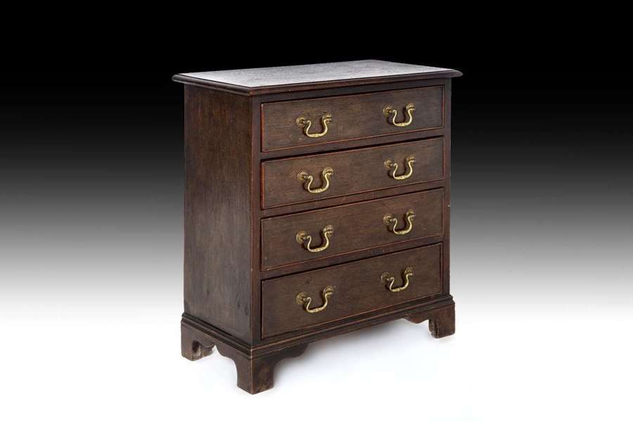 An unusual small scale mahogany chest of drawers