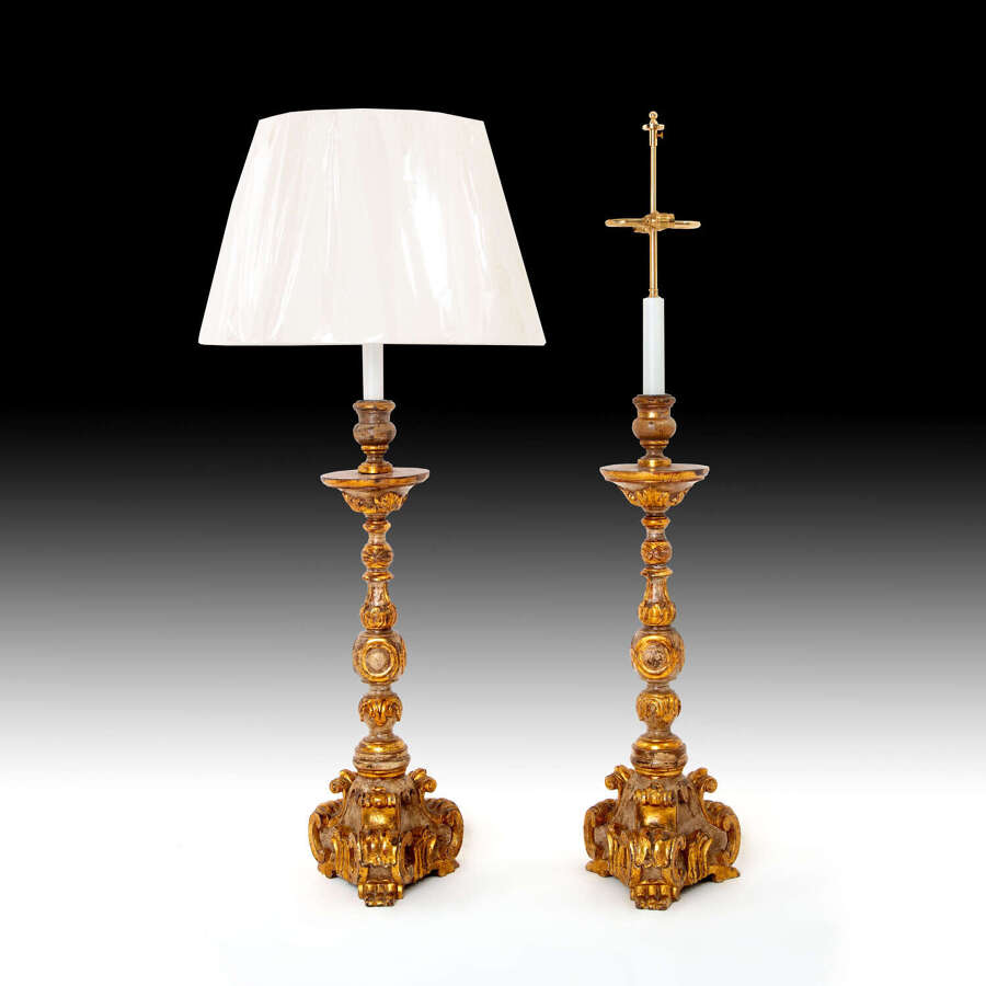 A pair of late 17th century giltwood candlesticks